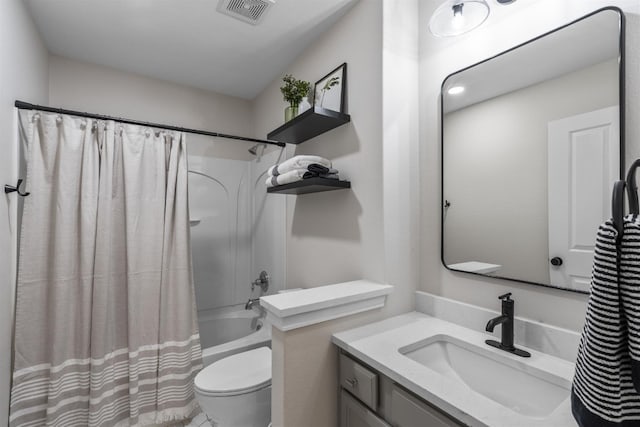 full bathroom with vanity, shower / tub combo, and toilet