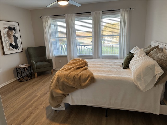 208 Bright Leaf Trl, Georgetown, TX 78633 - bedroom with light wood-style floors, baseboards, and a ceiling fan