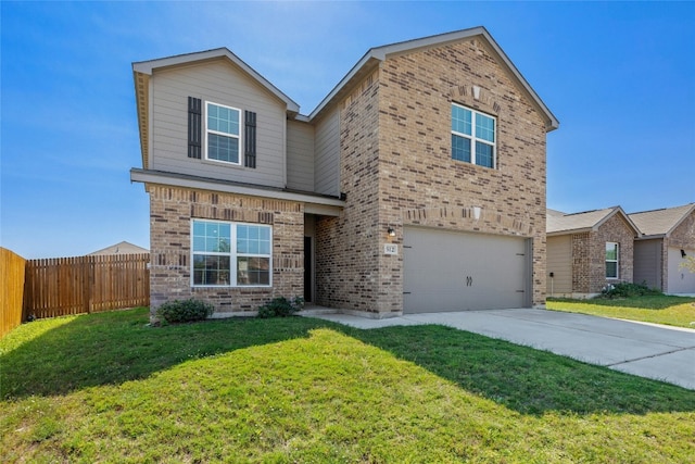 front of property with a front lawn and a garage