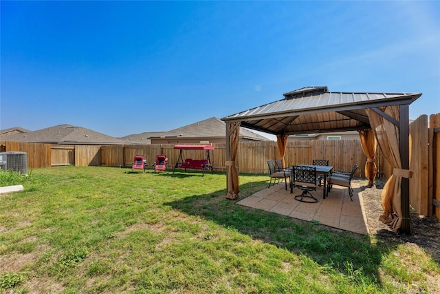 view of yard with a patio, a gazebo, and central air condition unit