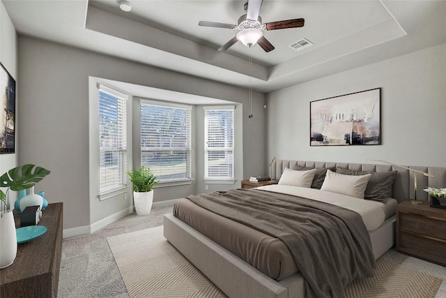 3317 Venezia Vw, Leander, TX 78641 - bedroom featuring a raised ceiling, light colored carpet, baseboards, and ceiling fan
