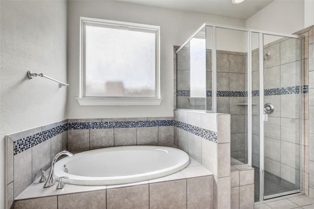 3317 Venezia Vw, Leander, TX 78641 - bathroom featuring a stall shower and a garden tub