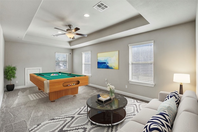 game room featuring light carpet, a tray ceiling, ceiling fan, and pool table