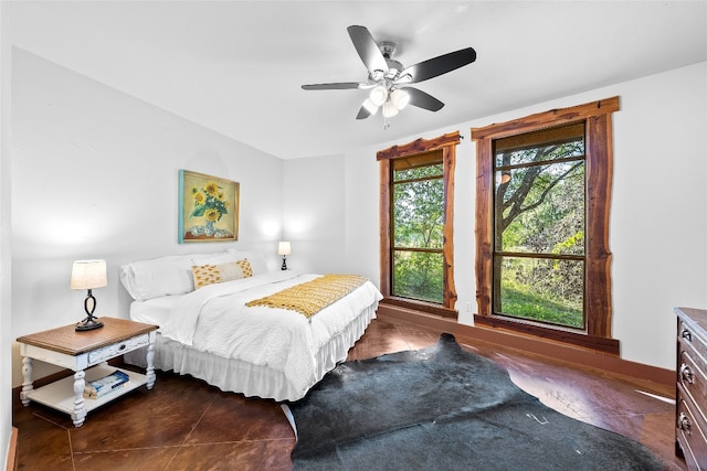 tiled bedroom with ceiling fan