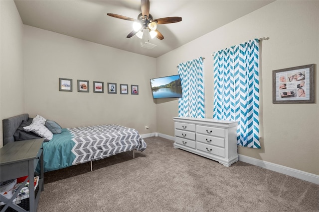 bedroom featuring baseboards, ceiling fan, and light colored carpet