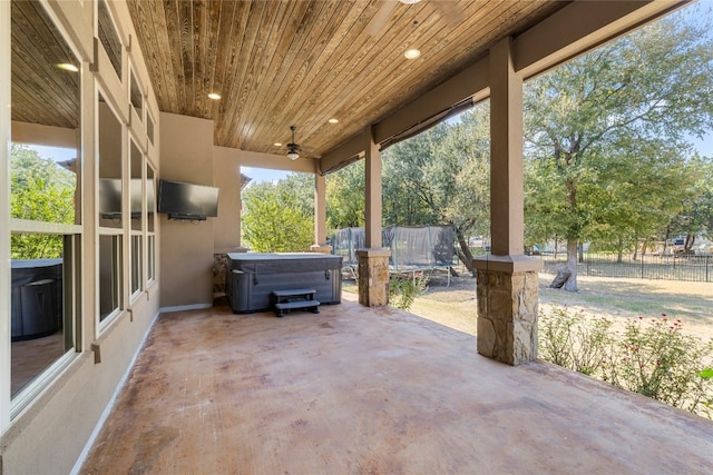 view of patio / terrace with a hot tub