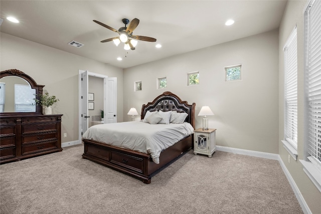 bedroom with ceiling fan, recessed lighting, light colored carpet, visible vents, and baseboards