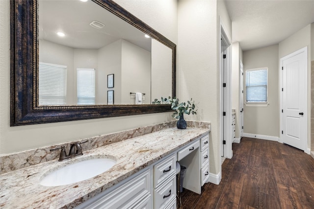 bathroom featuring vanity and hardwood / wood-style floors