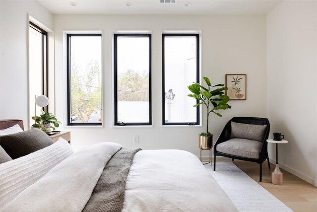2112 Lawnmont Ave, Austin, TX 78756 - bedroom with light wood-style flooring and baseboards