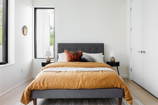 2112 Lawnmont Ave, Austin, TX 78756 - bedroom featuring hardwood / wood-style flooring and baseboards