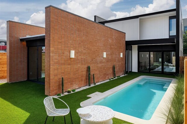 2112 Lawnmont Ave, Austin, TX 78756 - back of property featuring a lawn and an outdoor pool