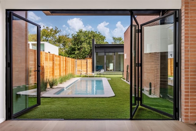 2112 Lawnmont Ave, Austin, TX 78756 - doorway to outside featuring wood finished floors