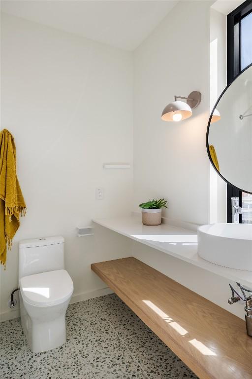 2112 Lawnmont Ave, Austin, TX 78756 - bathroom featuring speckle patterned floor and vanity