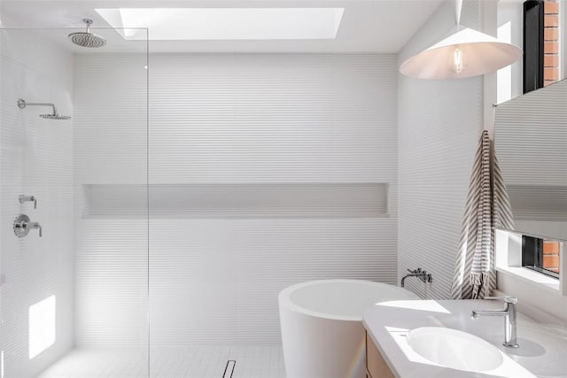 2112 Lawnmont Ave, Austin, TX 78756 - bathroom with a walk in shower, a freestanding bath, vanity, and a skylight