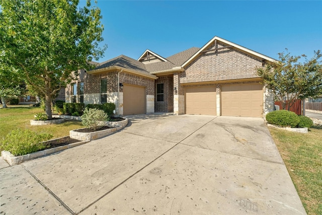 view of front facade featuring a front yard and a garage