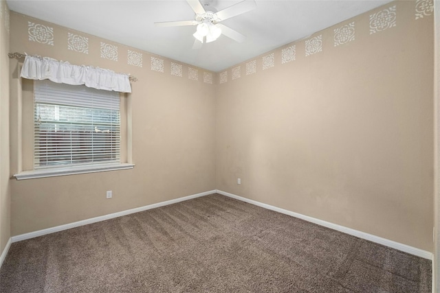 carpeted empty room featuring ceiling fan