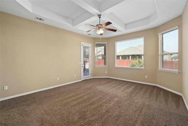 carpeted spare room featuring plenty of natural light, beamed ceiling, coffered ceiling, and ceiling fan