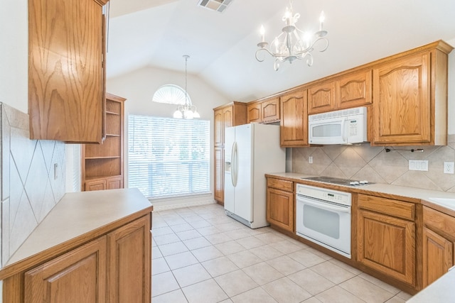 kitchen with light tile patterned flooring, white appliances, vaulted ceiling, a notable chandelier, and hanging light fixtures