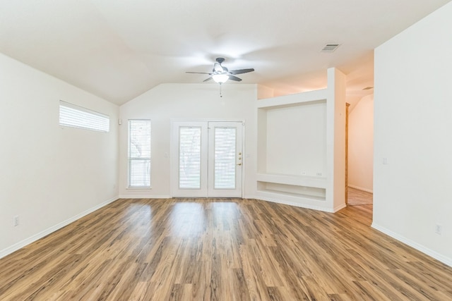 unfurnished living room with vaulted ceiling, ceiling fan, and hardwood / wood-style floors