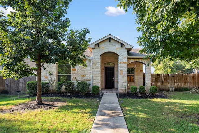 view of front of home with a front lawn