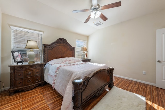 bedroom featuring ceiling fan, lofted ceiling, and hardwood / wood-style floors