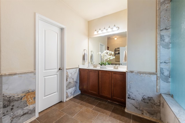 bathroom featuring tile patterned floors, tile walls, and vanity