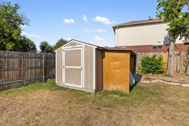 view of outbuilding featuring a lawn