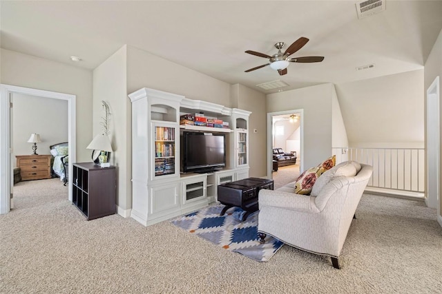 carpeted living room featuring ceiling fan