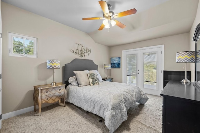 carpeted bedroom featuring access to exterior, french doors, vaulted ceiling, and ceiling fan