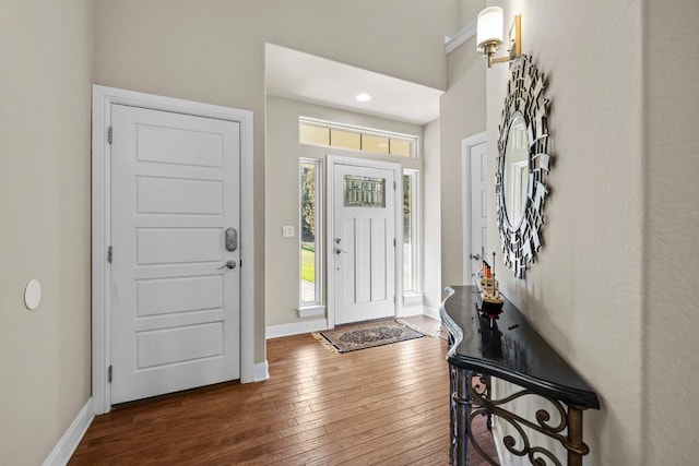 entrance foyer with dark hardwood / wood-style floors