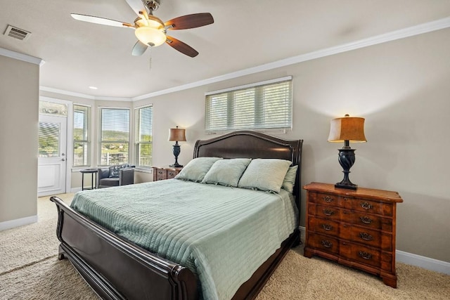 carpeted bedroom with ceiling fan and crown molding