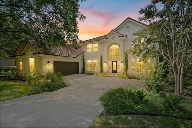 mediterranean / spanish-style home featuring a garage