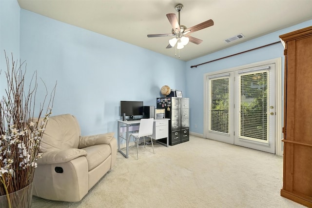 carpeted office featuring ceiling fan