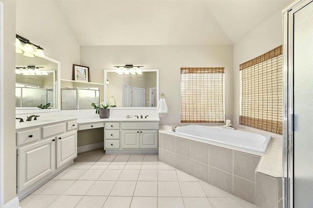 bathroom featuring shower with separate bathtub, vanity, tile patterned floors, and lofted ceiling