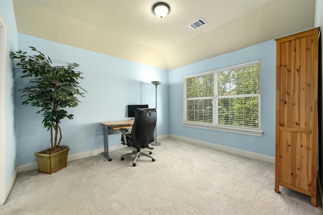 home office with carpet flooring and lofted ceiling