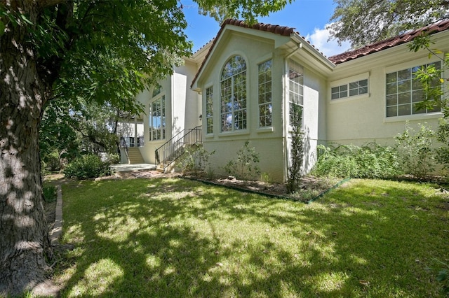 view of property exterior featuring a yard