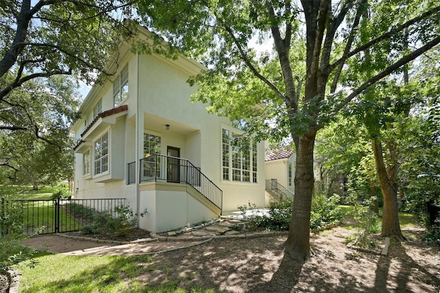 back of property with a balcony