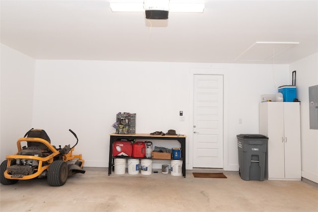 garage with electric panel and a garage door opener