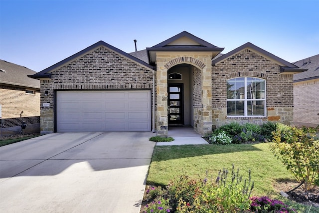 ranch-style house featuring a front yard and a garage