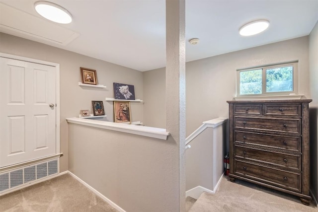 4910 Pelham Dr, Austin, TX 78727 - hall featuring carpet flooring and an upstairs landing