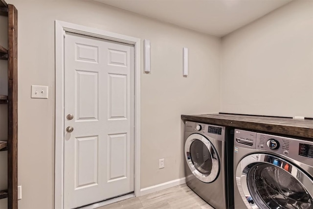 4910 Pelham Dr, Austin, TX 78727 - washroom with washing machine and dryer and light wood finished floors