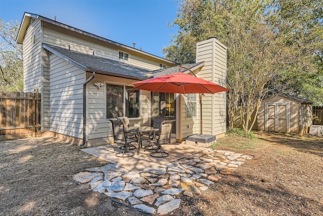 4910 Pelham Dr, Austin, TX 78727 - back of property with a patio area, a shed, and a chimney