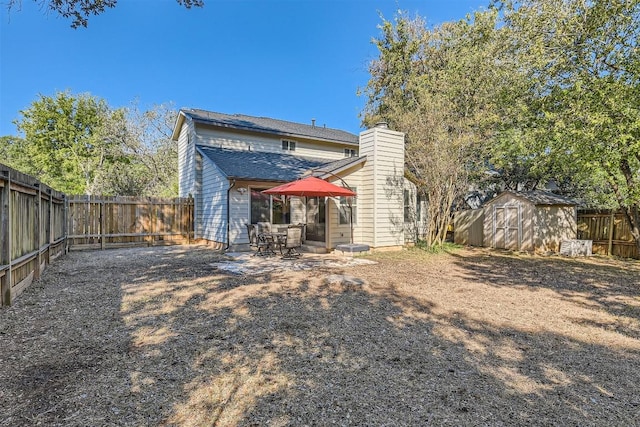 4910 Pelham Dr, Austin, TX 78727 - rear view of property with a shed, a fenced backyard, a chimney, and a patio