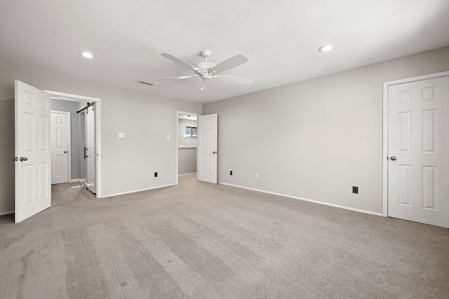 4910 Pelham Dr, Austin, TX 78727 - unfurnished bedroom with carpet flooring, recessed lighting, and a ceiling fan