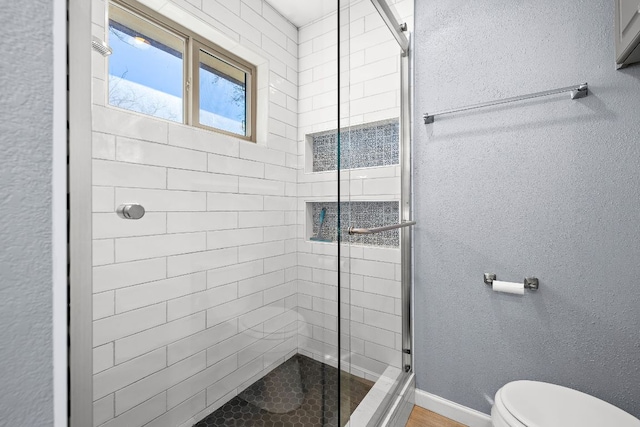 4910 Pelham Dr, Austin, TX 78727 - full bathroom featuring a stall shower and a textured wall