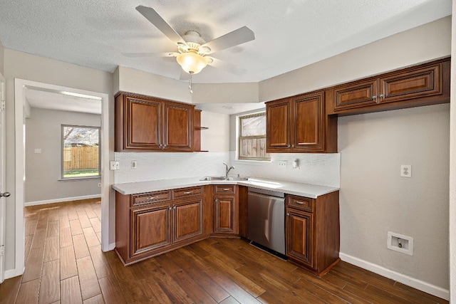 4910 Pelham Dr, Austin, TX 78727 - kitchen featuring dishwasher, dark wood-style floors, decorative backsplash, light countertops, and a ceiling fan