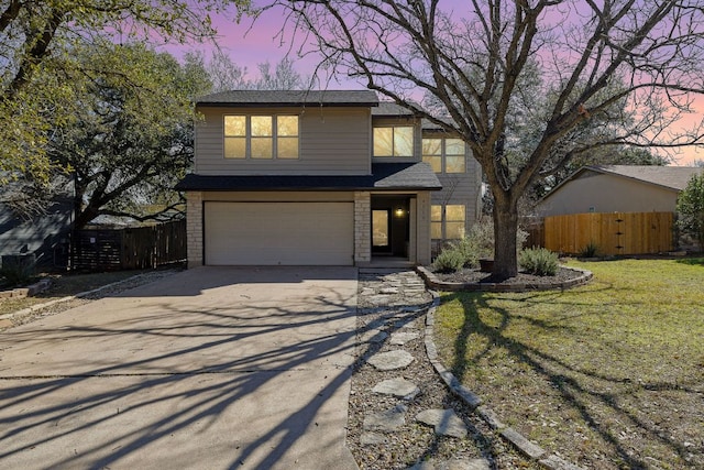 4910 Pelham Dr, Austin, TX 78727 - traditional-style house featuring a garage, driveway, and brick siding