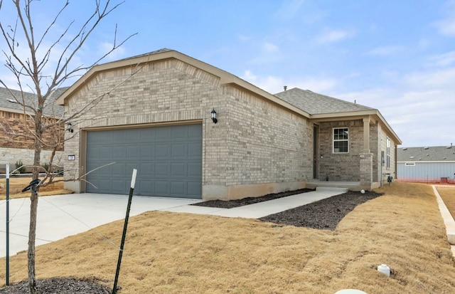 view of front of home with a garage, brick siding, driveway, and roof with shingles