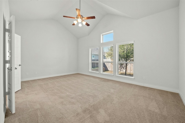 unfurnished room with light carpet, high vaulted ceiling, and ceiling fan