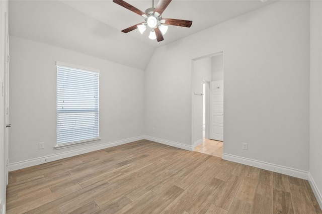 spare room featuring ceiling fan, vaulted ceiling, and light hardwood / wood-style floors